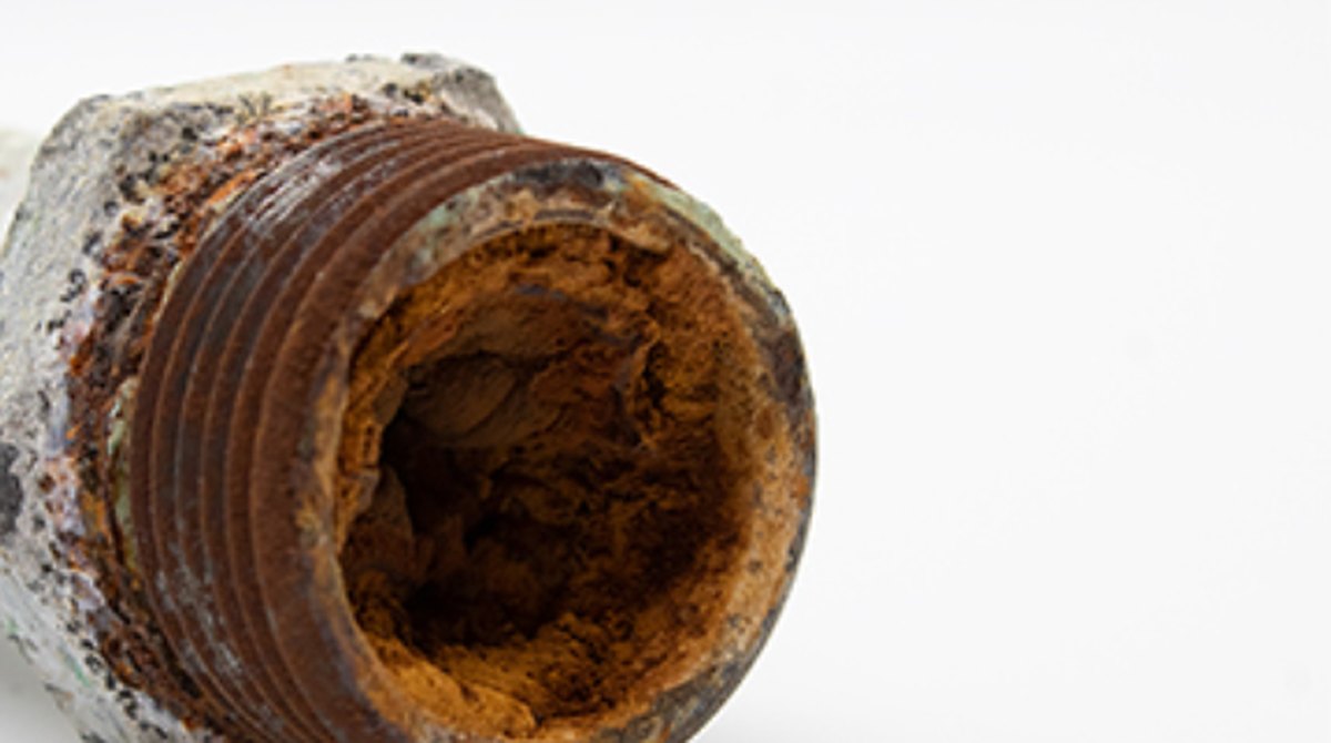 Cross section of a pipe narrowed by iron buildup