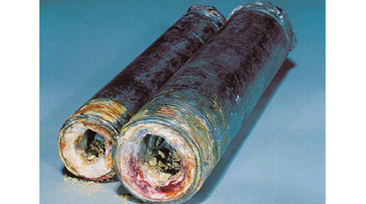 Corroded pipes showing scale and blue-green buildup