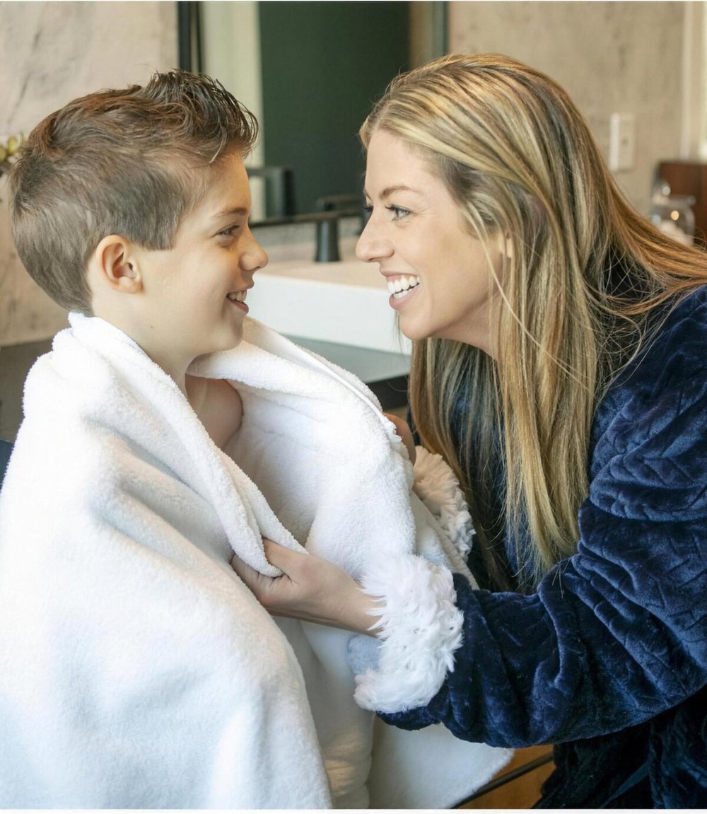 A parent and child after bath time